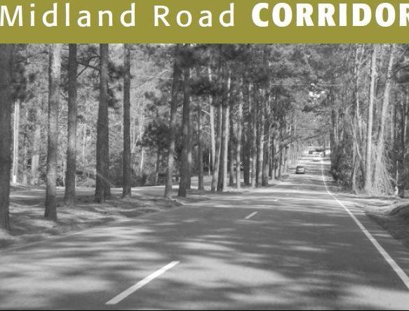 Image of a car traveling down Midland Road