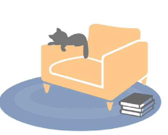 Cat snuggled on chair next to stack of books