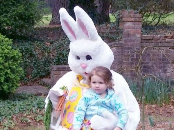 Image of Easter Bunny with child at Egg Hunt