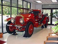 This is a picture of an old red fire truck